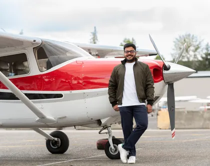 Alok Upadhyay standing beside a Cessna aircraft on the ramp